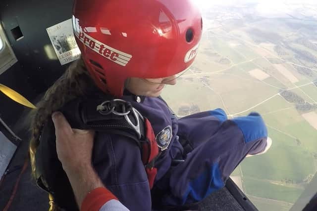 Jessica Brown prepares to jump out of the plane EMN-200310-114423001