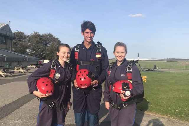 Jessica and Olivia Brown with Samuel Page before their solo charity parachute jumps EMN-200310-114342001