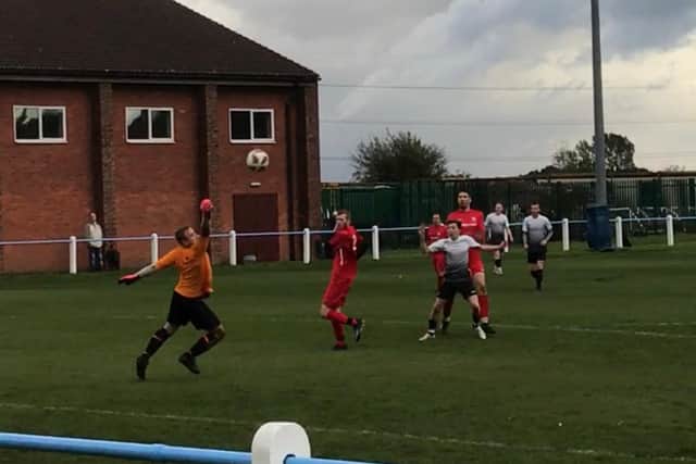 Tom Atherley has a shot on goal.