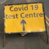 A sign on Burton Road bridge flagging up a recent Covid-19 test site in Melton EMN-201210-180723001