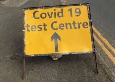 A sign on Burton Road bridge flagging up a recent Covid-19 test site in Melton EMN-201210-180723001