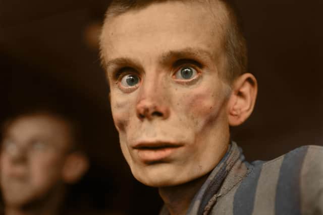 An 18-year-old Russian girl pictured during the liberation of Dachau concentration camp in 1945

Image: Tom Marshall (PhotograFix) EMN-201021-173437001