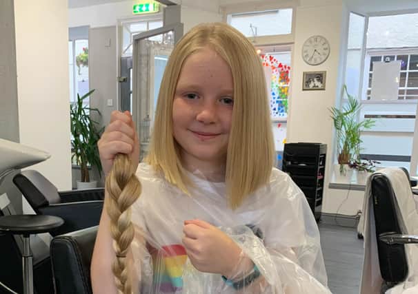Abigail Eaves who has raised money for the Little Princess Trust by having her long hair cut EMN-200311-110813001