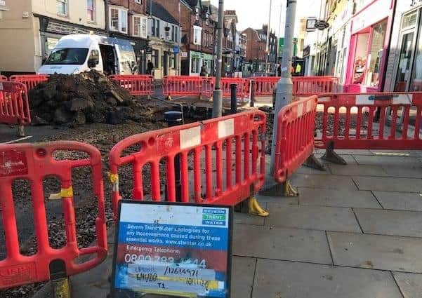 Severn Trent engineers at work this afternoon repairing the water main which burst on Sherrard Street, Melton, this morning - the road remains closed to traffic EMN-200611-150328001