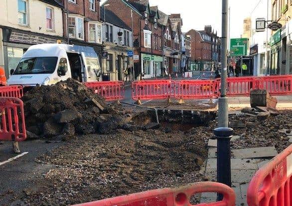 Severn Trent engineers at work this afternoon repairing the water main which burst on Sherrard Street, Melton, this morning - the road remains closed to traffic EMN-200611-150338001