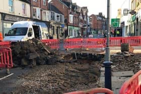Severn Trent engineers at work this afternoon repairing the water main which burst on Sherrard Street, Melton, this morning - the road remains closed to traffic EMN-200611-150338001