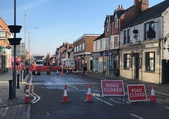 Severn Trent engineers at work this afternoon repairing the water main which burst on Sherrard Street, Melton, this morning - the road remains closed to traffic EMN-200611-150318001