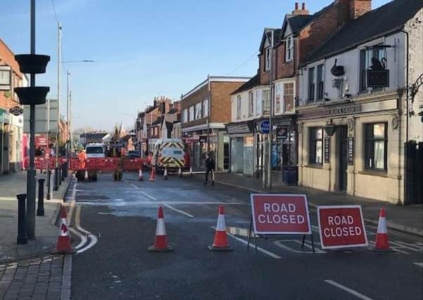 Severn Trent engineers at work repairing the water main which burst on Sherrard Street, Melton, on Friday morning - the road remains closed to traffic EMN-200611-150318001