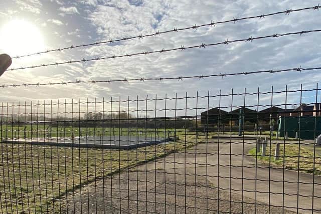 The seven-foot high fence which a swan was trapped behind at Asfordby EMN-201116-151707001