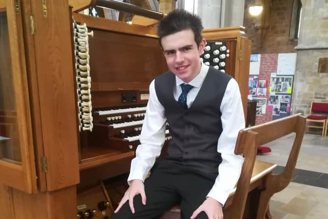 Talented musician Thomas Corden at the organ EMN-201117-153731001