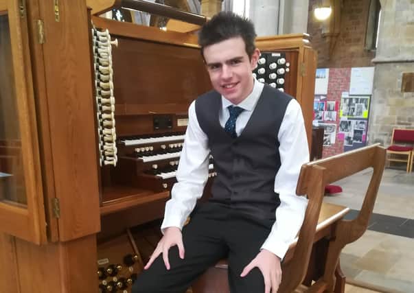Talented musician Thomas Corden at the organ EMN-201117-153731001