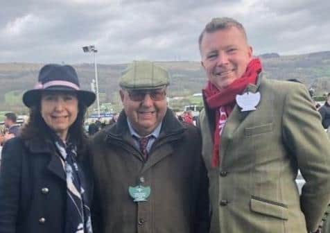 The late Phil Harvey pictured at a Cheltenham race meeting with daughter Sarah and son Lawrence EMN-201125-142819001