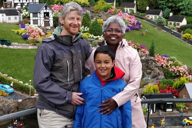 Jothi Brown, now 11, who survived a potentially deadly bout of meningitis, with mum Bharathi and dad Jeff EMN-200112-114215001