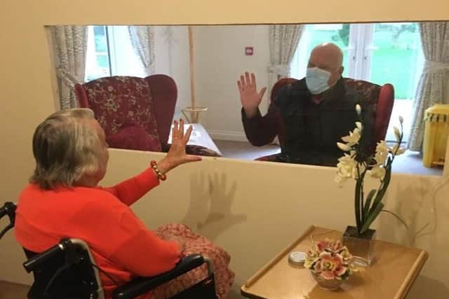 The dividing wall installed at Waltham Hall nursing home, which is keeping residents and their visitors safe during the coronavirus pandemic EMN-200712-131129001