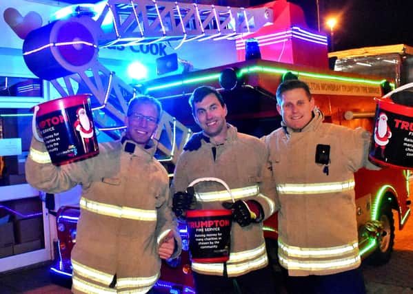 Firefighters Brent Penniston, Mark Bean and Matt McMullan with Melton's Trumpton Fire Engine last year
PHOTO: Tim Williams EMN-200912-172049001