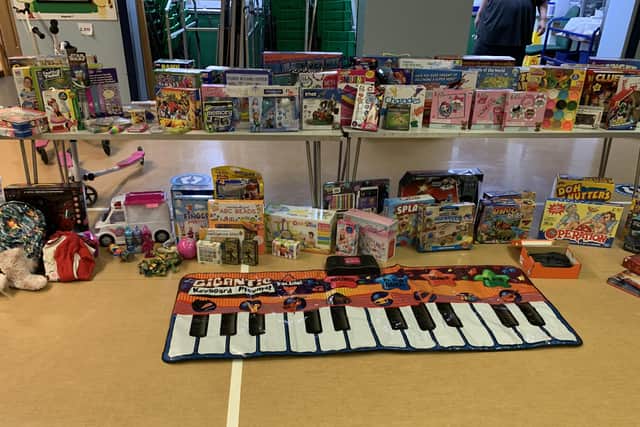 Some of the hundreds of donated toys in the hall at The Grove Primary School Lisa Godber has collected for struggling local families EMN-201214-125542001