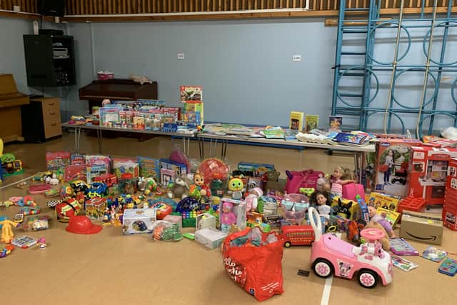 Some of the hundreds of donated toys in the hall at The Grove Primary School Lisa Godber has collected for struggling local families EMN-201214-125553001