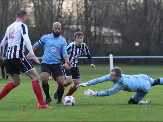 Linford Harris is thwarted by the Coalville keeper. Photo: Phil James