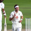 MANCHESTER, ENGLAND - JULY 26: Stuart Broad of England celebrates after taking the wicket of Kemar Roach of West Indies during Day Three of the Ruth Strauss Foundation Test, the Third Test in the #RaiseTheBat Series match between England and the West Indies at Emirates Old Trafford on July 26, 2020 in Manchester, England. (Photo by Michael Steele/Getty Images) 775534511