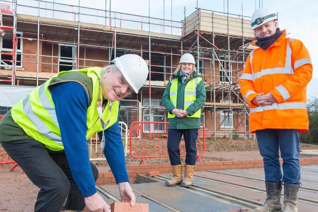 Mayor of Melton, Malise Graham, with McCarthy and Stone’s area sales manager, Andrea Shaw and Paul Bardon, senior site manager, as he lays the first brick in a major new retirement housing scheme off Scalford Road EMN-201218-094040001