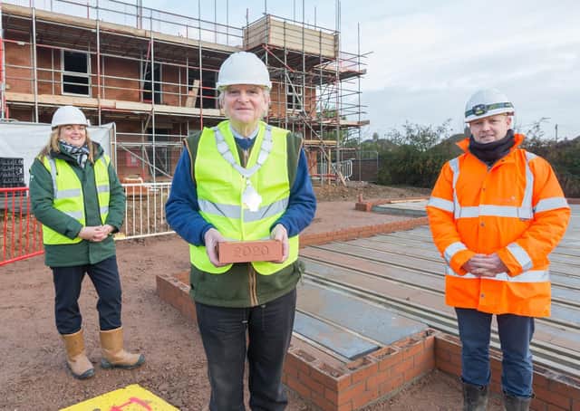 Mayor of Melton, Malise Graham, with McCarthy and Stone’s area sales manager, Andrea Shaw and Paul Bardon, senior site manager, as he lays the first brick in a major new retirement housing scheme off Scalford Road EMN-201218-094029001
