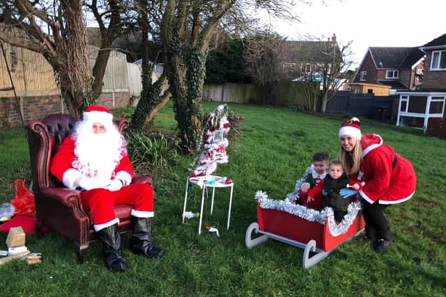 Graham and Kirsty Wells, aka Santa and Mrs Claus, at their special outdoor sanitised grotto for Severn Hill families EMN-201221-113203001