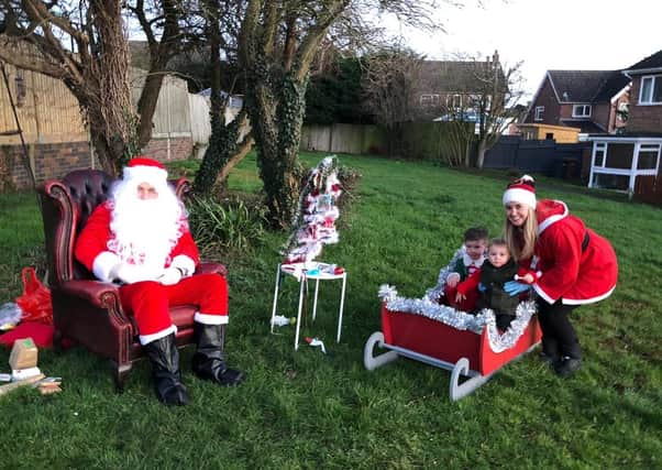 Graham and Kirsty Wells, aka Santa and Mrs Claus, at their special outdoor sanitised grotto for Severn Hill families EMN-201221-113203001