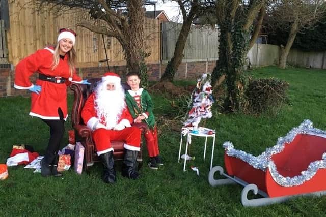 Graham and Kirsty Wells, aka Santa and Mrs Claus, at their special outdoor sanitised grotto for Severn Hill families EMN-201221-113214001