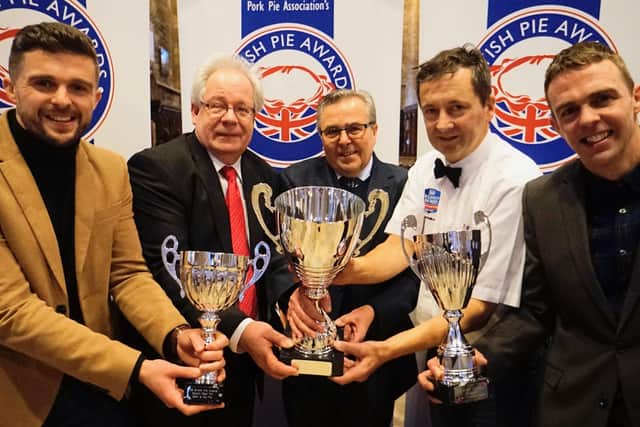 Turner's Pies show off their trophy haul from the British Pie Awards, with organiser Matthew O'Callaghan (second from left) and Dickinson and Morris MD Stephen Hallam (second from right) EMN-201222-081117001