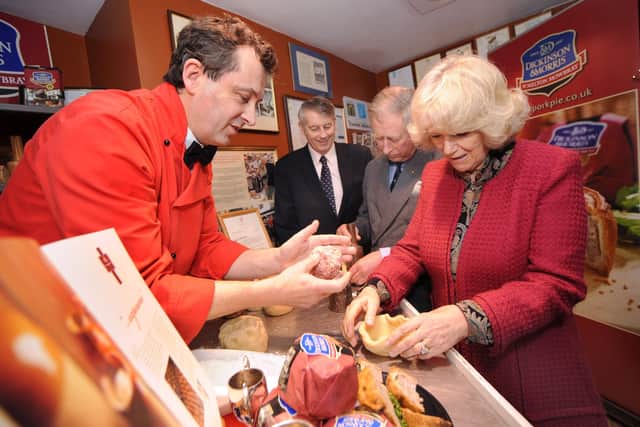 Making traditional Melton Mowbray Pork Pies during their Visit to Ye Olde Pork Pie Shoppe in Melton Mowbray... L-R Stephen Hallam, managing director of Dickinson and Morris, Brian Stein, group chief executive of Samworth Brothers, Prince Charles and the Duchess of Cornwall EMN-201222-082256001
