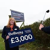 Tanya Smith, sales advisor for Bellway East Midlands, photographed with David Hirst, marketing director at Melton Mowbray Golf Club.