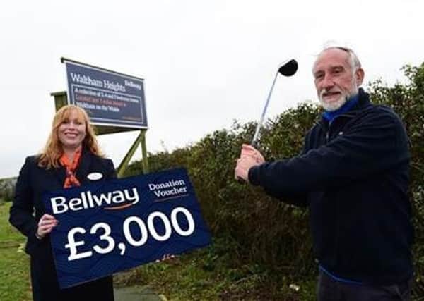 Tanya Smith, sales advisor for Bellway East Midlands, photographed with David Hirst, marketing director at Melton Mowbray Golf Club.