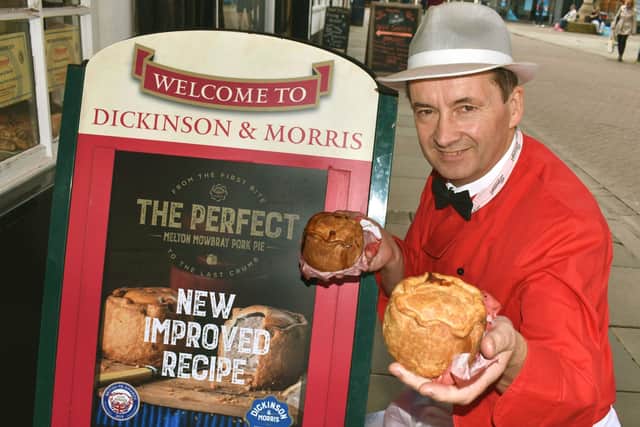 Managing director, Stephen Hallam, shows off the revamped Dickinson and Morris Melton Mowbray pork pie outside Ye Olde Pork Pie Shoppe in Nottingham Street, Melton EMN-201222-081021001