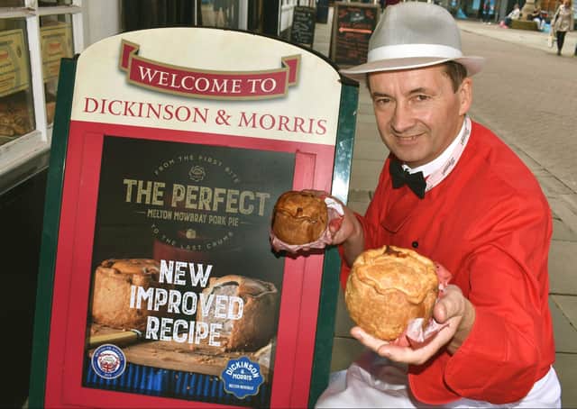 Managing director, Stephen Hallam, shows off the revamped Dickinson and Morris Melton Mowbray pork pie outside Ye Olde Pork Pie Shoppe in Nottingham Street, Melton EMN-201222-081021001