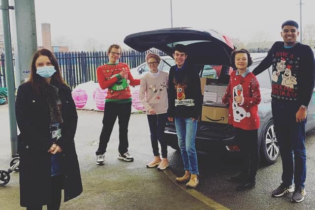 Students and staff at Birch Wood Area Special School with their collected donations for Storehouse EMN-201223-172309001