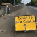 A sign on Burton Road bridge flagging up a Covid-19 test site in Melton EMN-210501-083904001