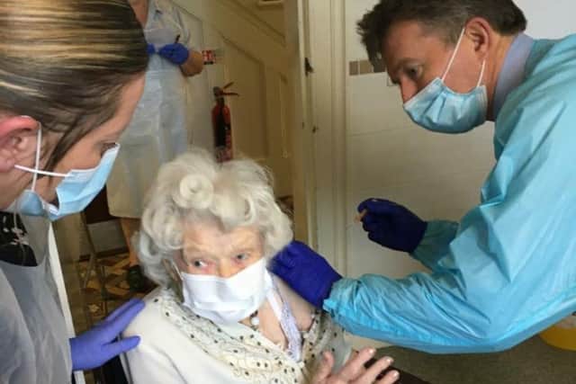 Joan Heaton (100) receives her coronavirus vaccine jab at Waltham Hall Nursing Home EMN-210113-091456001
