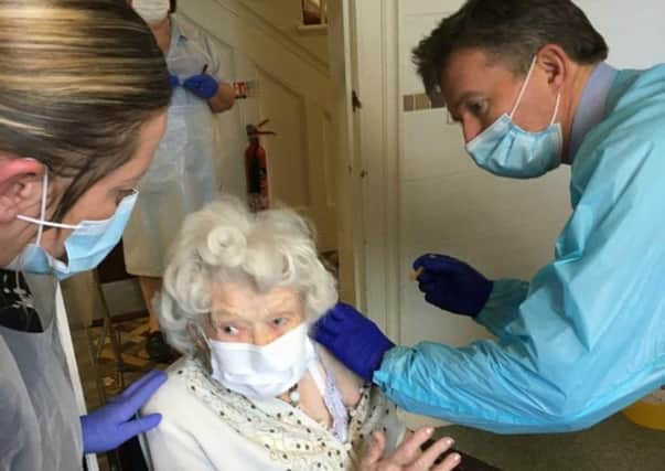 Joan Heaton (100) receives her coronavirus vaccine jab at Waltham Hall Nursing Home EMN-210113-091456001