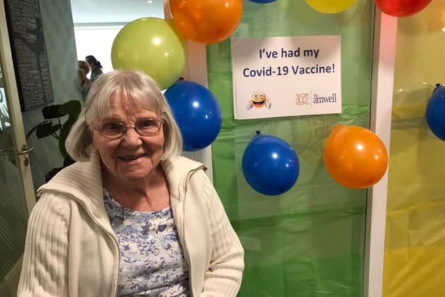 A happy resident of The Amwell care home in Melton after receiving a Covid vaccination EMN-210113-091506001