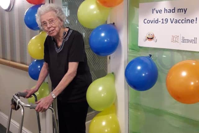 A happy resident of The Amwell care home in Melton after receiving a Covid vaccination EMN-210113-091517001