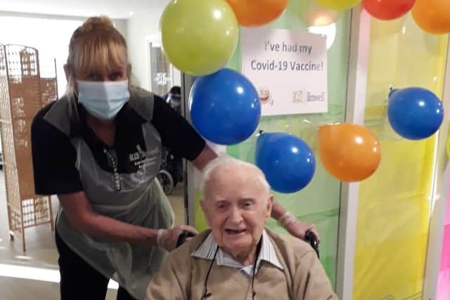 A happy resident of The Amwell care home in Melton after receiving a Covid vaccination EMN-210113-091538001
