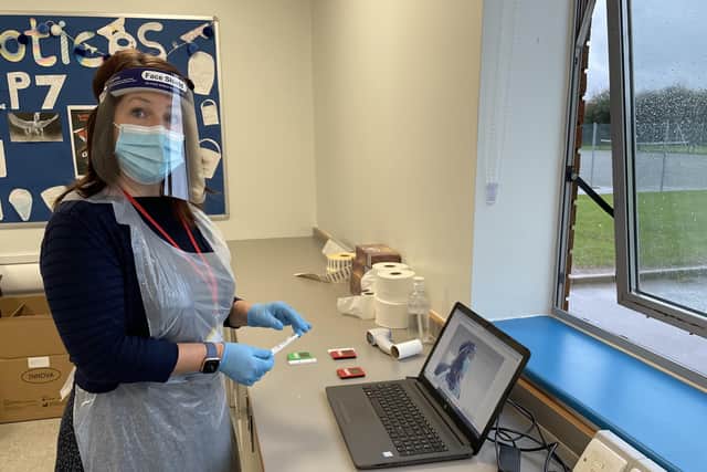 A member of the Covid testing team at Long Field Academy in Melton EMN-210120-121757001
