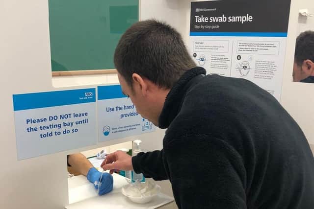 A rapid lateral flow test being taken for coronavirus at Leicestershire County Council's Wigston Fields site EMN-210120-155405001