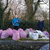 Melton Matters Wombles members John Spencer and Sharon Mccutcheon with 30 bags of rubbish they collected on Monday in Melton EMN-210302-141025001