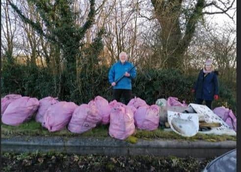 Melton Matters Wombles members John Spencer and Sharon Mccutcheon with 30 bags of rubbish they collected on Monday in Melton EMN-210302-141025001