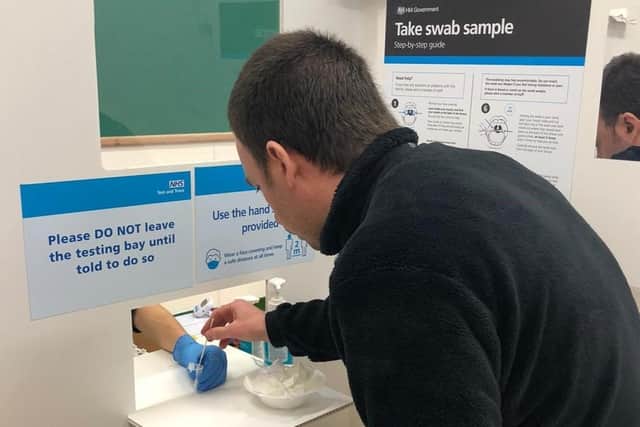 A rapid lateral flow coronavirus test being taken at a Leicestershire County Council site EMN-210128-183619001