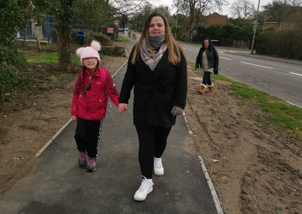 Kaci Chapman walking with mum, Kym Durrance, on her charity challenge for Newlife EMN-210102-164529001