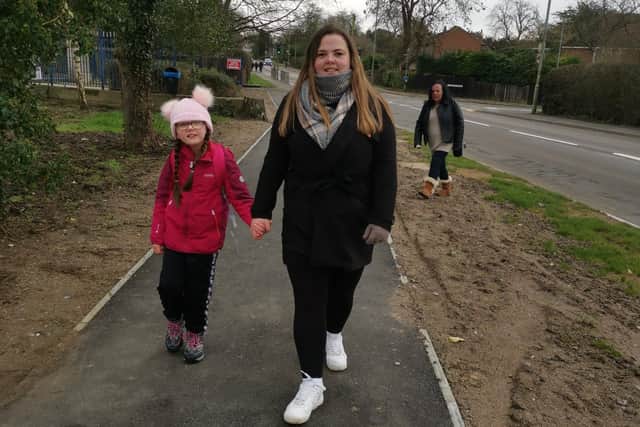 Kaci Chapman walking with mum, Kym Durrance, on her charity challenge for Newlife EMN-210102-164529001