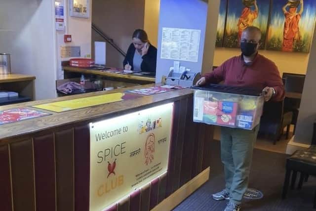 Uzzal and his team at the Spice Club, in Nottingham Street, Melton, box up more food hampers for disadvantaged local families EMN-210202-122231001