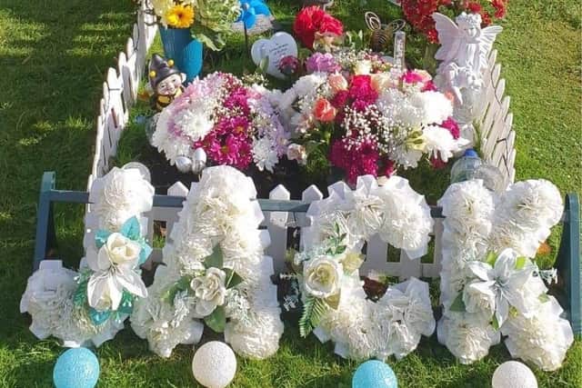 The decorated Thorpe Road cemetery grave of Jack Morrison, who passed away in February 2020 aged 23 EMN-210202-163958001